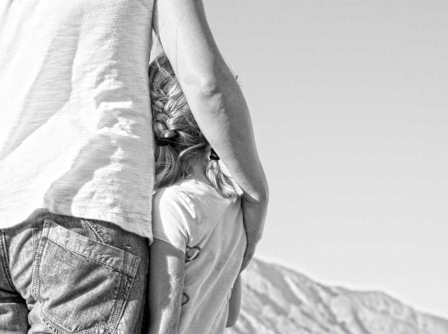 A black and white photo of a man and his daughter.