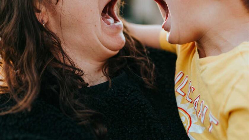 A woman and her son yelling at each other.