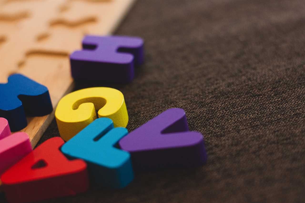 A set of colorful wooden letters on a table.