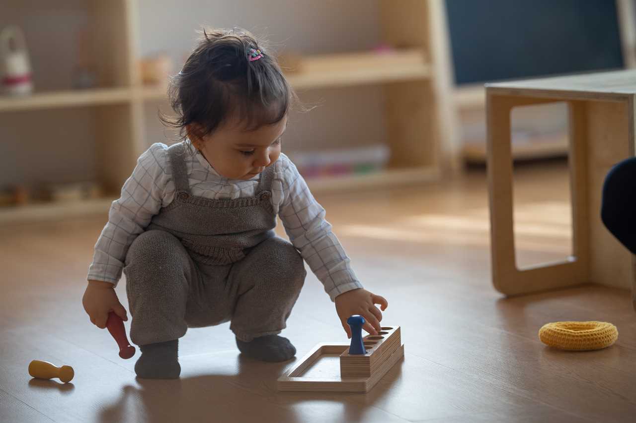 A young girl playing with wooden toys in a room.